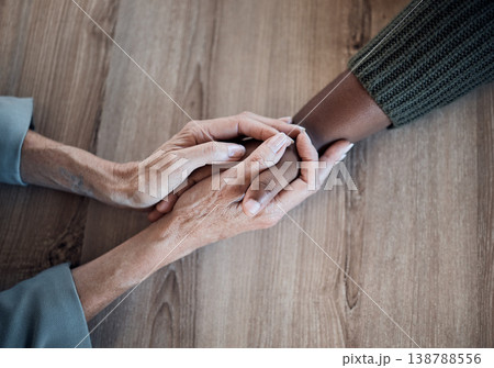 Holding hands, support and counselling, help and trust with people, top view with psychology and people pray together. Kindness, respect and worship, therapy and wellness with communication and care 138788556