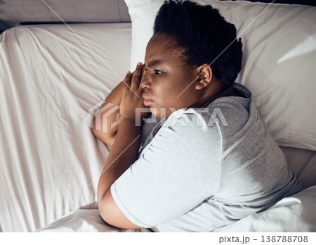 Stress, thinking or black woman in bed with insomnia or anxiety from sleeping problem in bedroom. Wake up, burnout or tired African girl with mistake, loss or depression from emotional grief at home Stress, thinking or black woman in bed with insomnia or anxiety from sleeping problem in bedroom. Wake up, burnout or tired African girl with mistake, loss or depression from emotional grief at home 138788708