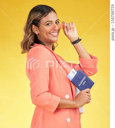 Portrait, passport and young woman for travel opportunity, USA immigration and sunglasses on yellow background. Identity documents, flight ticket and indian person for holiday or vacation in studio Portrait, passport and young woman for travel opportunity, USA immigration and sunglasses on yellow background. Identity documents, flight ticket and indian person for holiday or vacation in studio 138788729