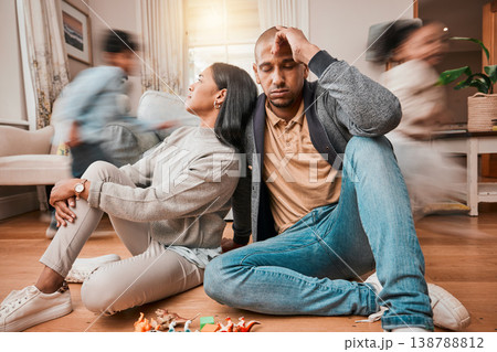 Family, adhd children and parents headache, stress and anxiety for autism management, energy fatigue or home noise. Tired mother and father on floor with chaos and hyper or fast, excited kids running Family, adhd children and parents headache, stress and anxiety for autism management, energy fatigue or home noise. Tired mother and father on floor with chaos and hyper or fast, excited kids running 138788812