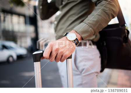 Suitcase, man hand and city with business person, watch and professional on urban street. Luggage, work travel and commute on a road with carry on bag for career and businessman holiday in town 138789031