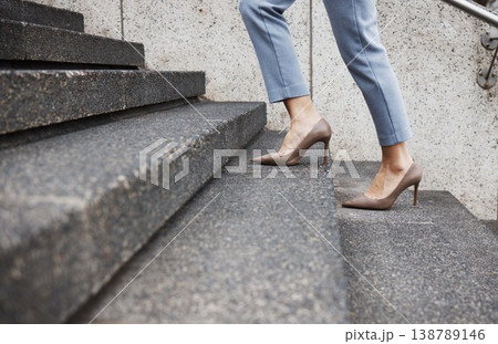 Staircase steps, legs and person walking, travel and morning journey to law firm, company or office building. Growth progress, future goals or closeup shoes, feet or lawyer climbing stairs to success Staircase steps, legs and person walking, travel and morning journey to law firm, company or office building. Growth progress, future goals or closeup shoes, feet or lawyer climbing stairs to success 138789146