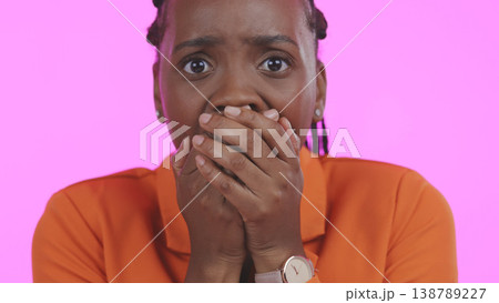 Woman, portrait and anxiety in studio for shock, surprise and scared of fear on pink background. Face of african model cover mouth for drama, alarm and emoji of gossip, secret news and omg reaction Woman, portrait and anxiety in studio for shock, surprise and scared of fear on pink background. Face of african model cover mouth for drama, alarm and emoji of gossip, secret news and omg reaction 138789227