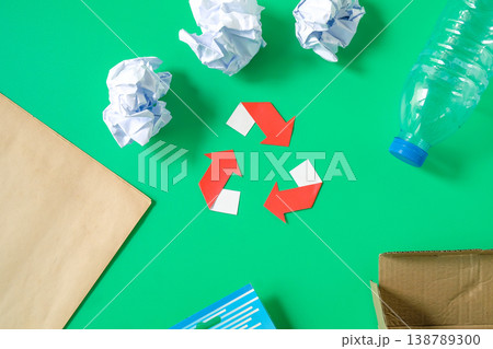 Recycle symbol with disposable paper and plastic. Recycle symbol with disposable paper and plastic. 138789300