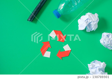Recycle symbol with disposable paper and plastic. Recycle symbol with disposable paper and plastic. 138789301