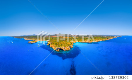 Aerial view of scenic Mallorca beach and turquoise bay with boats in Spain. Aerial view of scenic Mallorca beach and turquoise bay with boats in Spain. 138789302
