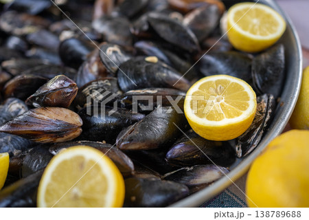 Fresh Mussels with Lemon Slices Background Seafood Texture Fresh Mussels with Lemon Slices Background Seafood Texture 138789688