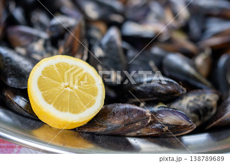 Fresh Mussels with Lemon Slices Background Seafood Texture 138789689
