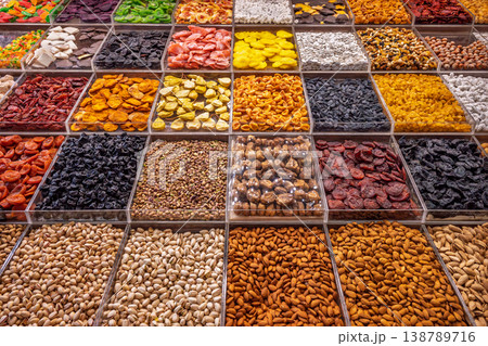 Assorted dried fruits and nuts in market display. Assorted dried fruits and nuts in market display. 138789716