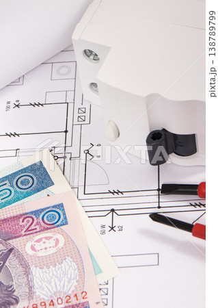 Electrical components with work tools, drawings of electric installation and polish currency Electrical components with work tools, drawings of electric installation and polish currency 138789799