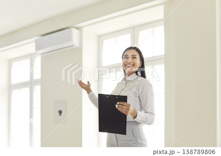 Portrait Of A Happy Woman Realtor Presenting A New Home Or Office Portrait Of A Happy Woman Realtor Presenting A New Home Or Office 138789806