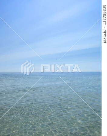 Seascape. Sea Smooth surface of the blue sea and blue sky. Abstract sea view scenery. Sea landscape. Skyline. Nature backdrop. Natural background. Nobody. Sun glare. Calm sunny weather. Small waves Seascape. Sea Smooth surface of the blue sea and blue sky. Abstract sea view scenery. Sea landscape. Skyline. Nature backdrop. Natural background. Nobody. Sun glare. Calm sunny weather. Small waves 138789839