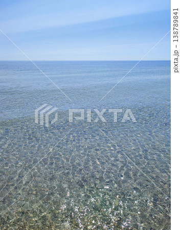 Seascape. Sea Smooth surface of the blue sea and blue sky. Abstract sea view scenery. Sea landscape. Skyline. Nature backdrop. Natural background. Nobody. Sun glare. Calm sunny weather. Small waves Seascape. Sea Smooth surface of the blue sea and blue sky. Abstract sea view scenery. Sea landscape. Skyline. Nature backdrop. Natural background. Nobody. Sun glare. Calm sunny weather. Small waves 138789841