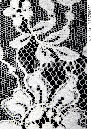 Close up of vintage lace fabric white on black background embroidery Close up of vintage lace fabric white on black background embroidery 138789953