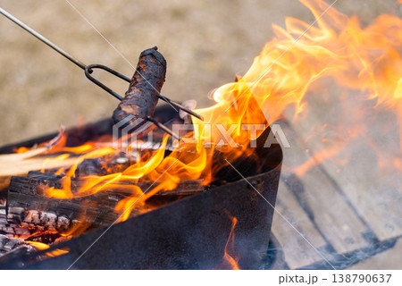 Flaming Grill with Burning Wood Logs Flaming Grill with Burning Wood Logs 138790637