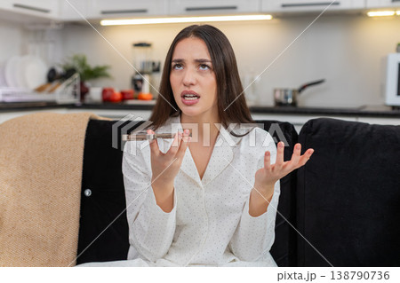 Young woman argues on speakerphone frowns talk with hands says what why explains point ends call mad Young woman argues on speakerphone frowns talk with hands says what why explains point ends call mad 138790736