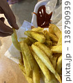 Crispy fries with ketchup and hand photo 138790939