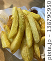 Golden crispy potato fries photo closeup 138790950