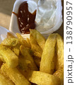 Golden fries with red sauce photo closeup 138790957