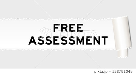 Ripped gray paper background that have word free assessment under torn part 138791049