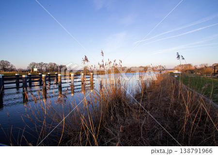 Sunrise on a February morning at river the IJssel in the Achterhoek. Photo taken in Laag-Keppel in the Netherlands. Sunrise on a February morning at river the IJssel in the Achterhoek. Photo taken in Laag-Keppel in the Netherlands. 138791966