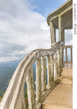 View from Ambuluwawa Tower, multi-religious temple complex located in Gampola, in Sri Lanka. Rustic Concrete Balustrade and Pavilion Stairs Overlooking Lush Mountain Landscape View from Ambuluwawa Tower, multi-religious temple complex located in Gampola, in Sri Lanka. Rustic Concrete Balustrade and Pavilion Stairs Overlooking Lush Mountain Landscape 138793178