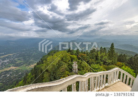 View from Ambuluwawa Tower, multi-religious temple complex located in Gampola, in Sri Lanka. Breathtaking Mountain Vista with Lush Green Landscape and Cloudy Sky from Viewing Point View from Ambuluwawa Tower, multi-religious temple complex located in Gampola, in Sri Lanka. Breathtaking Mountain Vista with Lush Green Landscape and Cloudy Sky from Viewing Point 138793192