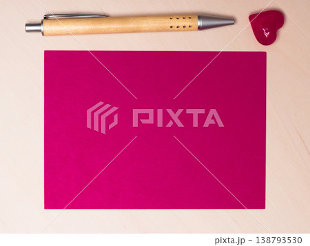 blank sheet of paper heart and pen on table 138793530