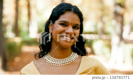 Indian woman smiling wearing traditional indian jewelry 138793771