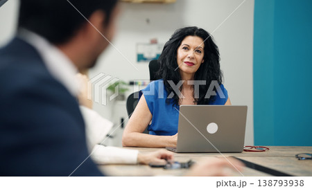 Business woman listening during office meeting discussion Business woman listening during office meeting discussion 138793938