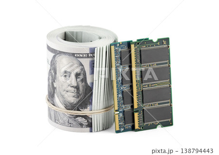 Computer memory ram with hundred dollar bills banknotes on white background. Concept of rising memory prices, expensive PC components and AI-driven demand. Computer memory ram with hundred dollar bills banknotes on white background. Concept of rising memory prices, expensive PC components and AI-driven demand. 138794443