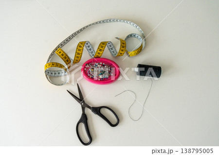 Sewing Machine and Tailoring Tools on White Background. Sewing Machine and Tailoring Tools on White Background. 138795005