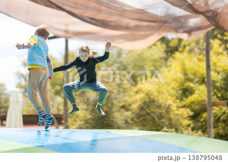 Children active jumping high on outdoor air pillow 138795048