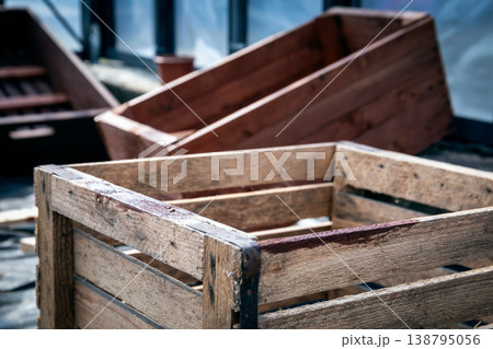 Freshly Stained Wooden Crate Showing Protective Coating on Rustic Surface 138795056
