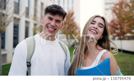 Happy university students smiling on campus outdoors Happy university students smiling on campus outdoors 138795479