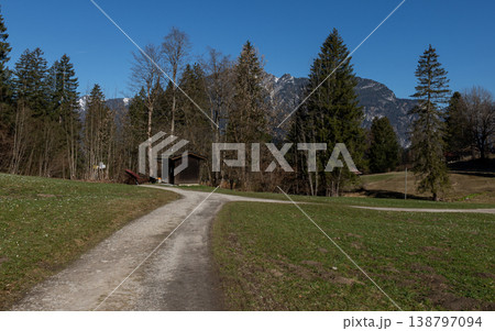 Curving gravel path leading to small hut in alpine countryside Curving gravel path leading to small hut in alpine countryside 138797094