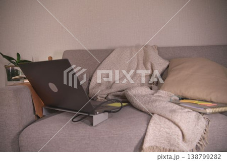 Remote work setup on a sofa for comfort 138799282