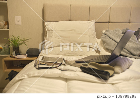 Bedroom study area with laptop and headphones on bed Bedroom study area with laptop and headphones on bed 138799298