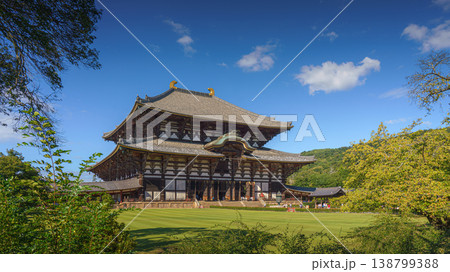 Nara, Japan - Sep 26 2024, Panoramic view of Todaiji Temple with lawn and trees in the foreground, at daytime with clear blue sky, Nara, Japan 138799388