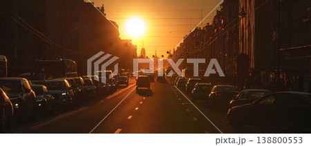 Saint-Petersburg, Russia - April 10 2026, panoramic view of Nevsky Prospect, cars on road, people walking on sidewalk, at sunset with bright sun, everything in orange light, St Petersburg, Russia 138800553