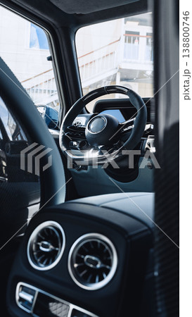 Steering wheel and dashboard view from inside a modern car with stylish design 138800746