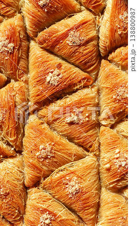 Desserts made from thin pastry shaped into triangles and baked until golden in color 138800987