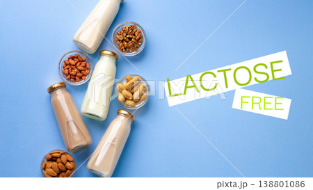 Lactose free dairy alternatives on a blue background with nuts and seeds Lactose free dairy alternatives on a blue background with nuts and seeds 138801086