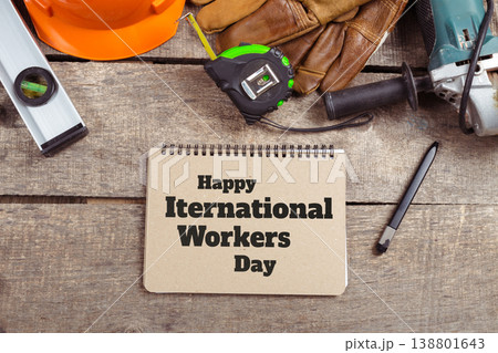 Celebrate international workers day on May 1 with tools and safety gear on a wooden surface 138801643