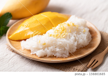 Mango sticky rice (Khao Niew Mamuang) with coconut milk and crispy mung beans Mango sticky rice (Khao Niew Mamuang) with coconut milk and crispy mung beans 138801685