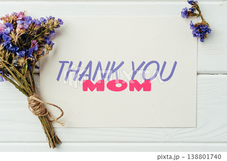 Celebrating Mother's Day with a thank you card and flowers on May 10 138801740