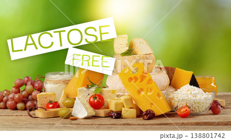 Lactose free cheese options with fruits and snacks on a wooden table 138801742