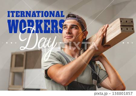 Celebration of International Workers Day on May 1 with a worker holding wooden planks 138801857