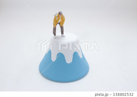 Miniature Figure On Abstract Blue Mountain Miniature Figure On Abstract Blue Mountain 138802532