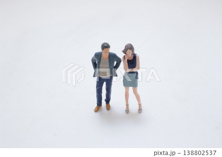 Miniature Couple Standing In Quiet Moment Miniature Couple Standing In Quiet Moment 138802537